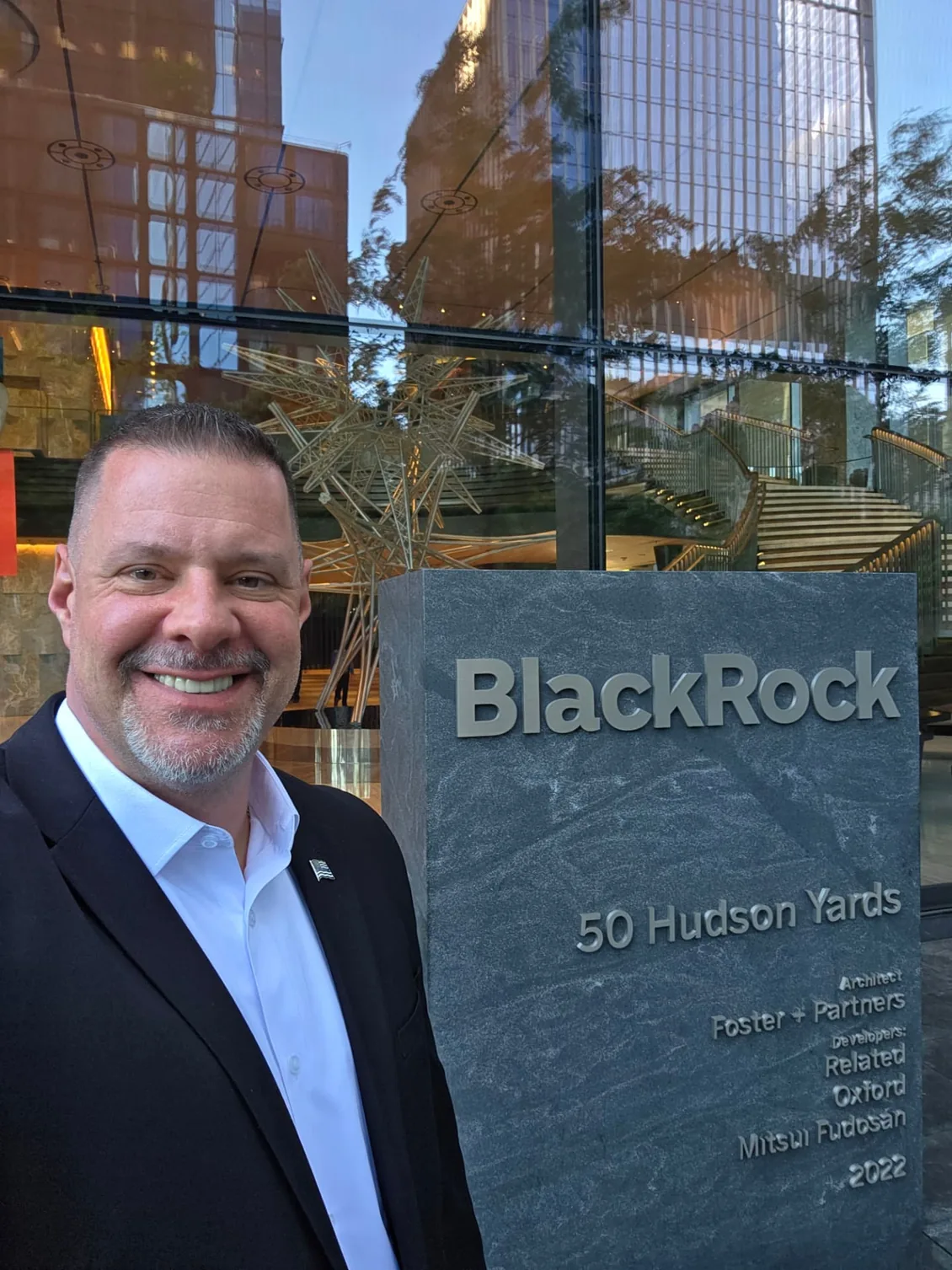 Shadow Securities executive protection agent outside the BlackRock headquarters entrance at 50 Hudson Yards in Manhattan